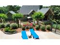 Secluded backyard oasis with lounge chairs, well-maintained landscaping, and a privacy fence, creating the perfect retreat at 102 Cavit Ct, Canton, GA 30114