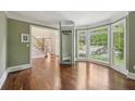 Living room features hardwood floors, bay window, and lift at 10660 Dunoon Dr, Alpharetta, GA 30022
