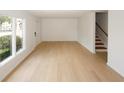 Bright living room with a staircase and a large window that allows natural light at 1199 Ashborough Se Dr # K, Marietta, GA 30067