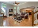 Spacious living room with hardwood floors, a fireplace, and abundant natural light at 1391 Sutters Dr, Lawrenceville, GA 30045