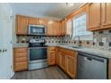 Modern kitchen with stainless steel appliances, granite countertops, and stylish backsplash at 441 Amy Blvd, Temple, GA 30179