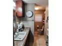 Bathroom with granite counter, modern cabinets, and ceramic tile at 6290 S Skyline Dr, Douglasville, GA 30135