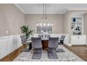 Formal dining room features stylish decor and a modern chandelier at 1120 Cordia Nw Ave, Atlanta, GA 30318