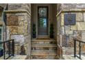 Charming doorway with natural stone steps and pillars, decorative wreath and clear numbering for address visibility at 1120 Cordia Nw Ave, Atlanta, GA 30318