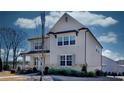 Attractive two-story home with stone accents, covered front porch, and nicely landscaped yard at 3173 Rockbridge Rd, Avondale Estates, GA 30002
