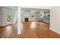 Spacious open-concept living area featuring gleaming hardwood floors, a cozy fireplace and lots of natural light at 2714 Eagles Crest Ln, Decatur, GA 30034