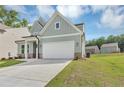 Charming two-story home with a well-manicured lawn, inviting front entrance and an attached garage at 107 Cedar Brook Dr, Canton, GA 30115