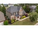 Beautiful home with stone and stucco, complemented by mature landscaping and a covered front porch at 208 Eagles Flight, Villa Rica, GA 30180