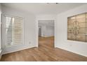 Sunroom features hardwood floors, white walls and large windows for natural light at 403 Abingdon Way, Atlanta, GA 30328