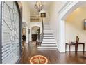 Grand foyer with hardwood floors, high ceilings, and a sweeping staircase at 503 Kensington Estates Trce, Woodstock, GA 30188