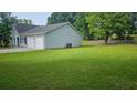 Expansive backyard featuring lush green grass and a fenced perimeter, ideal for outdoor activities at 4052 Keheley Glen Ne Dr, Marietta, GA 30066