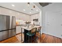 Kitchen boasts stainless steel appliances, a stylish island with seating, and modern cabinetry at 860 Peachtree Ne St # 1513, Atlanta, GA 30308