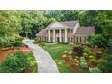 Beautiful home with mature trees, landscaped front yard and circular driveway at 2080 Old Dominion Rd, Atlanta, GA 30350