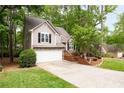 Charming two-story home with landscaped yard, an attached garage, and beautiful stone accents at 3573 Bramwell Nw Xing, Kennesaw, GA 30144