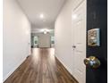Inviting foyer featuring wood flooring and a glimpse of the living room beyond at 3530 Ridge Hill Pkwy, Douglasville, GA 30135