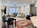 Open-concept living room with natural light and stylish decor at 5641 Roswell Rd # 111, Sandy Springs, GA 30342