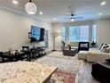 Bright living area featuring neutral tones, large windows, and modern furnishings at 5641 Roswell Rd # 111, Sandy Springs, GA 30342