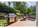 Spacious deck with outdoor seating and grill, perfect for entertaining and relaxation at 5370 Newport Bay Psge, Alpharetta, GA 30005