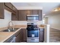 Well-equipped kitchen with stainless steel oven and microwave, ample cabinet space, and updated finishes at 6366 Jasper Ct, Tucker, GA 30084