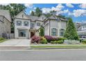 Attractive two-story home with a brick facade, well-maintained landscaping, and a charming entrance at 1839 Kent Ave, Atlanta, GA 30338