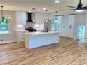 Bright, spacious kitchen with quartz countertops, a large island, and stainless steel appliances at 323 W Claiborne Ct, Marietta, GA 30066