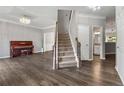 Elegant entryway boasting hardwood floors, staircase, and chandelier lighting at 2994 Meadow Church Rd, Suwanee, GA 30024