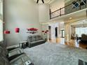 Spacious living room featuring high ceilings, large windows, and modern decor at 3784 The Great Dr, Atlanta, GA 30349
