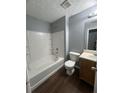 Bathroom featuring a tub with shower, white tile and a modern vanity at 3953 Cress Way Run, Decatur, GA 30034