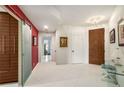 Hallway featuring tile flooring, flush lighting and a decorative sliding door at 2660 Peachtree Nw Rd # 13H, Atlanta, GA 30305