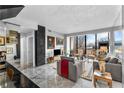 Open living space with marble floors and a large window, complemented by modern furnishings and decor at 145 15Th Ne St # 409, Atlanta, GA 30309