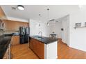 Modern kitchen features stainless steel appliances, dark countertops and wooden cabinets at 711 Cosmopolitan Ne Dr # 300, Atlanta, GA 30324