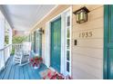 Inviting front porch with rocking chairs, perfect for relaxing and enjoying the neighborhood view at 1935 Shrader Ct, Lawrenceville, GA 30044
