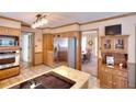 Spacious kitchen featuring stainless steel appliances and a view into the sunny dining area at 1935 Shrader Ct, Lawrenceville, GA 30044