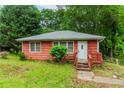 Cozy one-story home with charming front porch and mature trees at 551 Barnes Mill Dr, Marietta, GA 30062