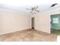 Spacious living room with original hardwood floors and a ceiling fan at 551 Barnes Mill Dr, Marietta, GA 30062