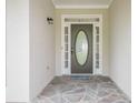 Welcoming entryway featuring a stone floor and an oval-shaped glass insert front door at 861 Soaring Dr, Marietta, GA 30062