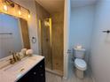 Updated bathroom featuring a glass-enclosed shower and modern vanity at 877 Verona Dr, Clarkston, GA 30021