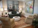 Cozy living room with plush seating, decorative rug, and ample natural light at 962 Manor Parc Dr, Decatur, GA 30033