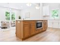 Kitchen island with breakfast bar seating, stainless appliances, and wooden cabinets at 1826 Terry Mill Se Rd, Atlanta, GA 30316