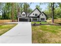 Charming two-story home with a two car garage and well manicured lawn at 2263 Barge Rd, Atlanta, GA 30331