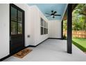 Covered back patio with ceiling fan and a view of the backyard at 2263 Barge Rd, Atlanta, GA 30331