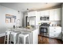 Modern kitchen featuring granite countertops, stainless steel appliances, and island seating at 23 Clifton Se St, Atlanta, GA 30317