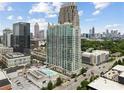 High-rise building in a city setting, featuring rooftop pool and scenic skyline views at 361 17Th Nw St # 1603, Atlanta, GA 30363