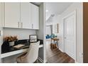 Cozy home office nook with built-in desk and cabinets, next to the main entrance at 361 17Th Nw St # 1603, Atlanta, GA 30363
