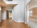 Inviting foyer with hardwood floors, arched doorways, and natural light shining through the entry at 4087 Kingsley Park Ct, Peachtree Corners, GA 30096