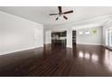 Open-concept living room with hardwood floors, recessed lighting, and an easy flow to the kitchen at 6660 Country Lake Rd, Cumming, GA 30041