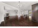Spacious living area showcasing hardwood floors and an open layout to the modern kitchen at 6660 Country Lake Rd, Cumming, GA 30041