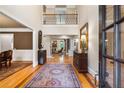 Grand foyer with hardwood floors, high ceilings, and elegant staircase at 13037 Overlook Pass, Roswell, GA 30075