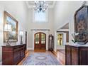 Grand foyer with high ceilings, chandelier, hardwood floors and elegant decor at 13037 Overlook Pass, Roswell, GA 30075