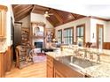 Inviting living room with beamed ceilings, fireplace, built-ins, and granite countertops at 13037 Overlook Pass, Roswell, GA 30075